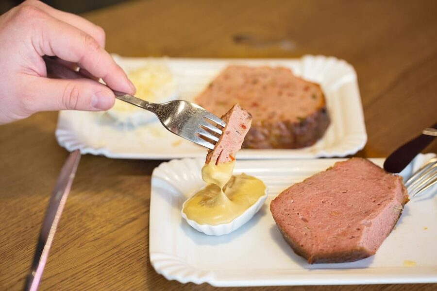 Vienna: Best of Vienna Food Tour - Austrian ham, horseradish, and wine in a cellar