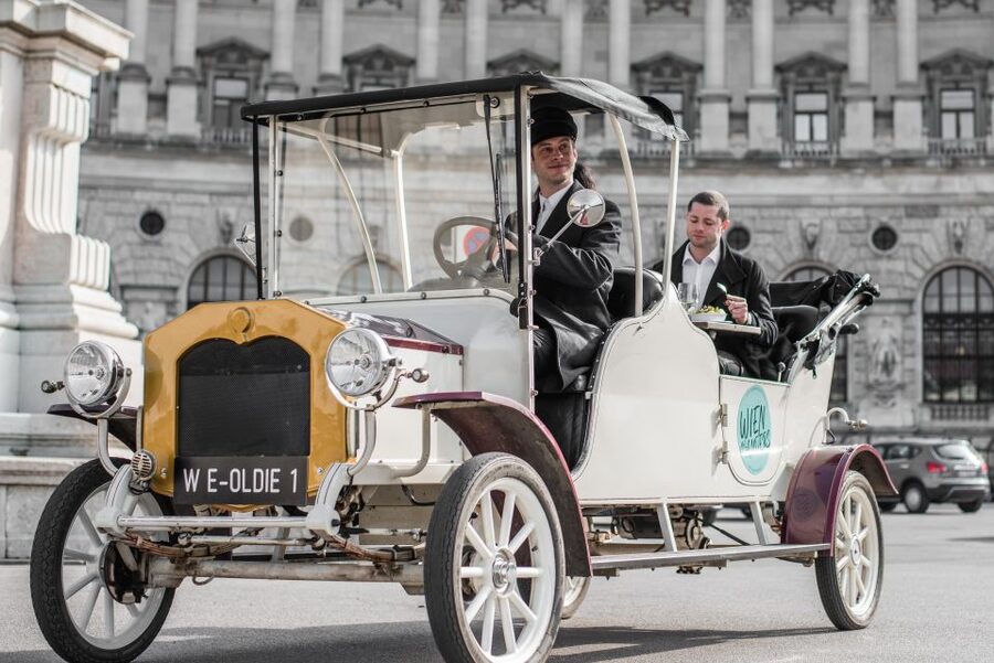 Vienna: Culinary Sightseeing Tour in an Electric Vintage Car - Eating and drinking inside the vintage car
