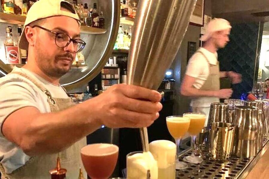 Vienna Nightlife: Food, Wine, Cocktails and Rooftop Bar Tour - Starting at Karlskirche as Vienna turns golden