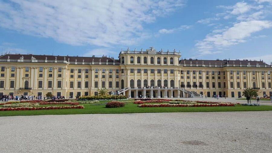 Vienna: Schönbrunn Palace & Christmas Market Walking Tour - Entering through the separate entrance