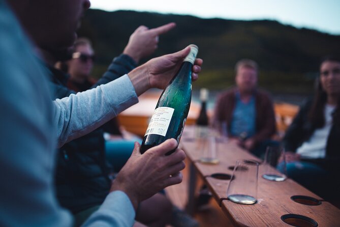 Wine tasting on traditional wooden boats in Wachau Valley - The Wachauer Nase and the river’s changing views